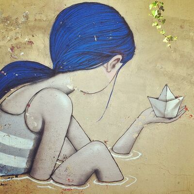 A street painting of a girl with long blue hair holding a paper boat, on a weathered wall