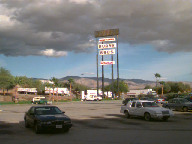 Motel and gas station signs along a highway